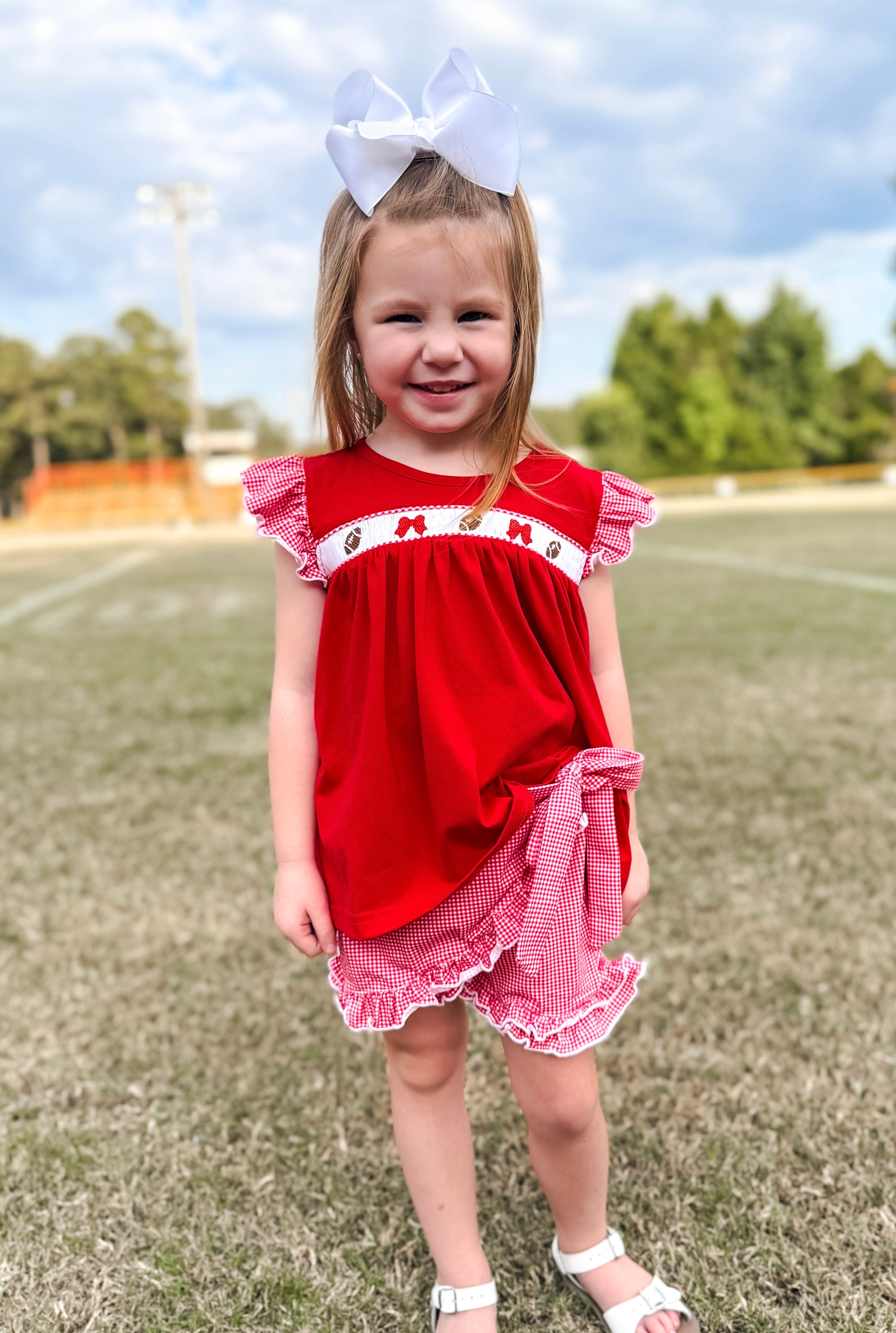 Red Smocked Footballs and Bows Tie Skort