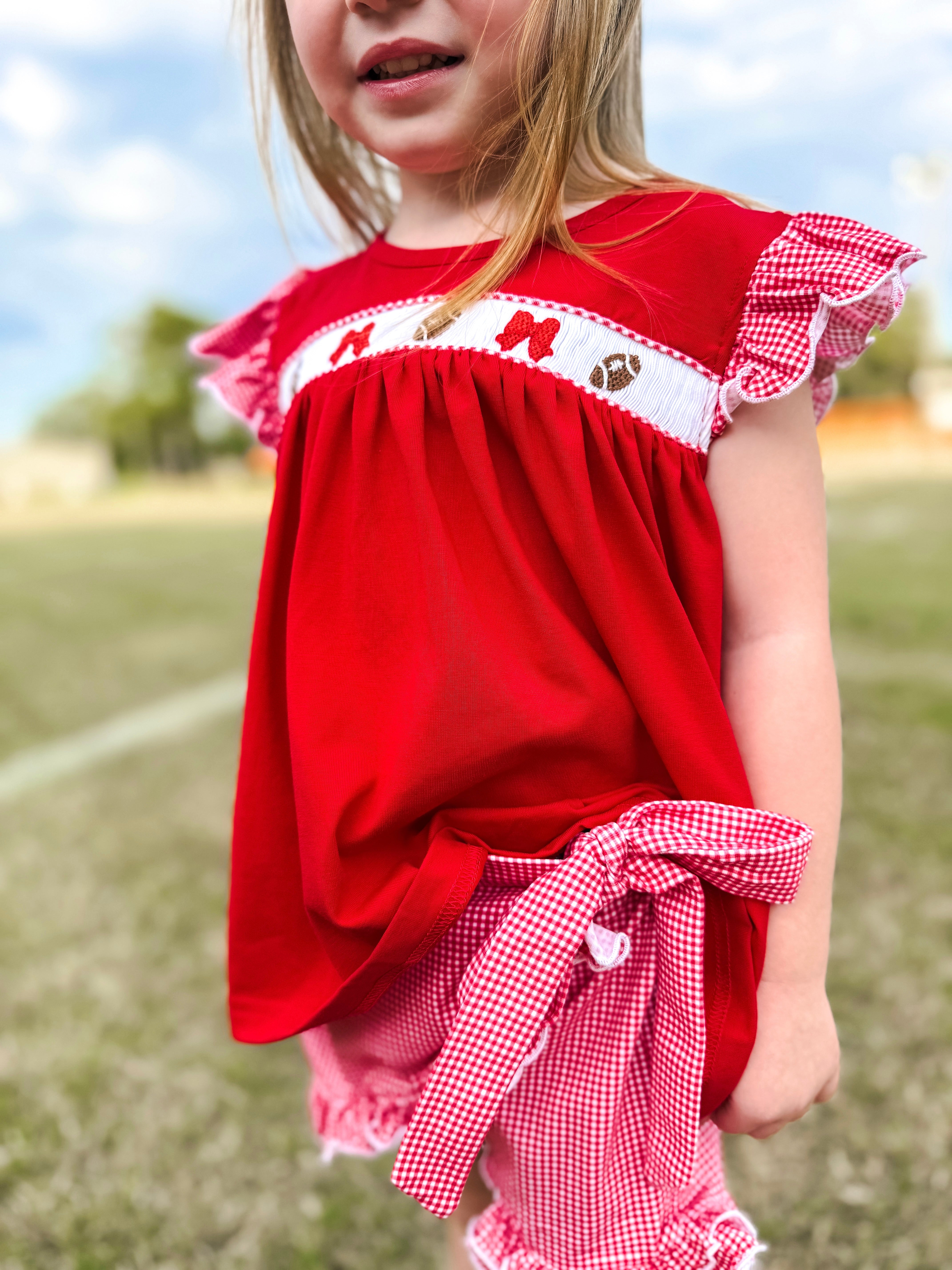 Red Smocked Footballs and Bows Tie Skort