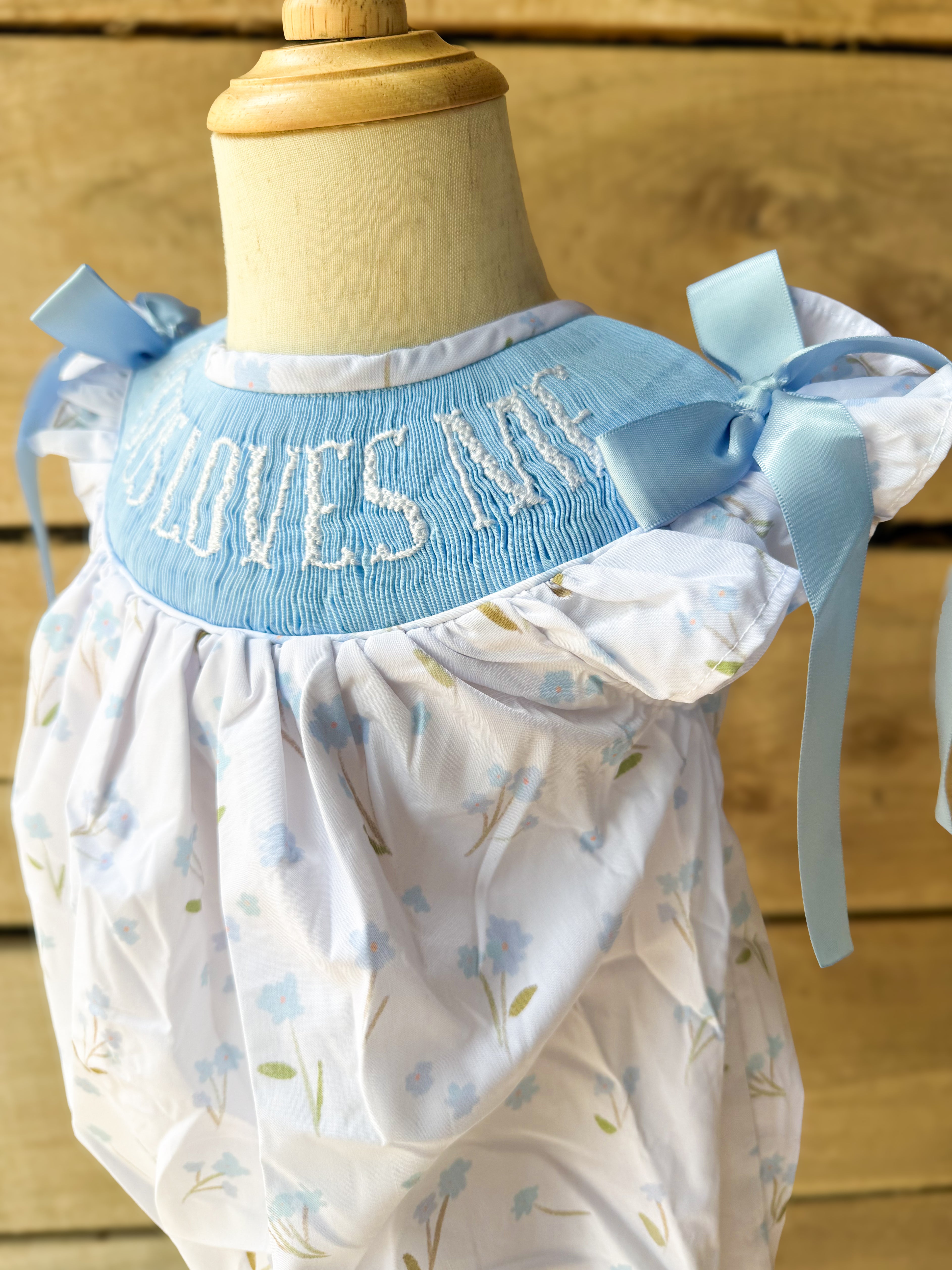 Girls “Jesus Loves Me” Smocked Blue Meadow Bubble